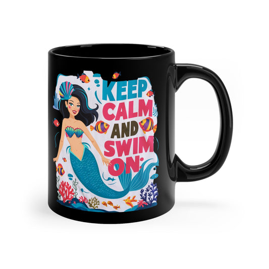 Black coffee mug with side handle; mermaid graphic and “KEEP CALM AND SWIM ON”