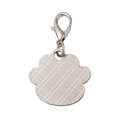 Dog paw print keychain charm with textured beige back and silver lobster clasp