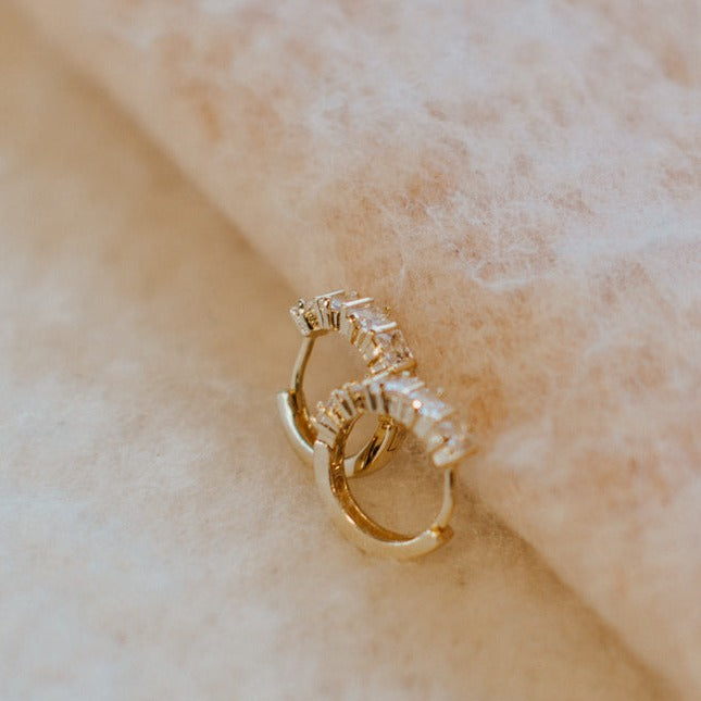 Close-up of gold-filled hoops set with sparkling diamonds
