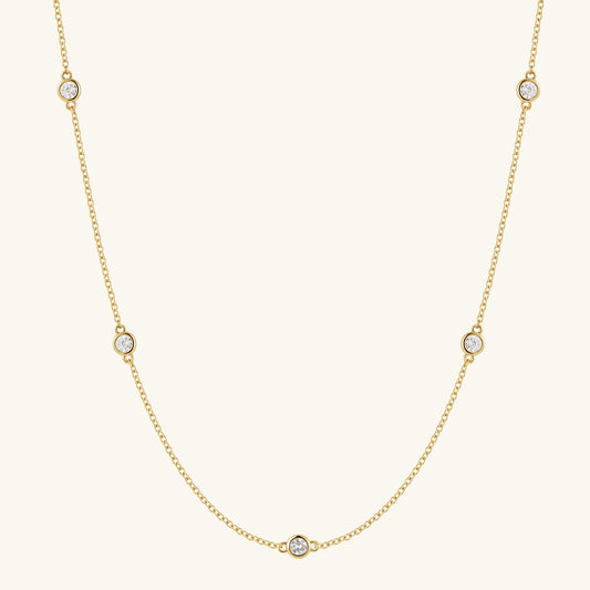 Gold-filled diamond necklace with five round stones on a fine chain