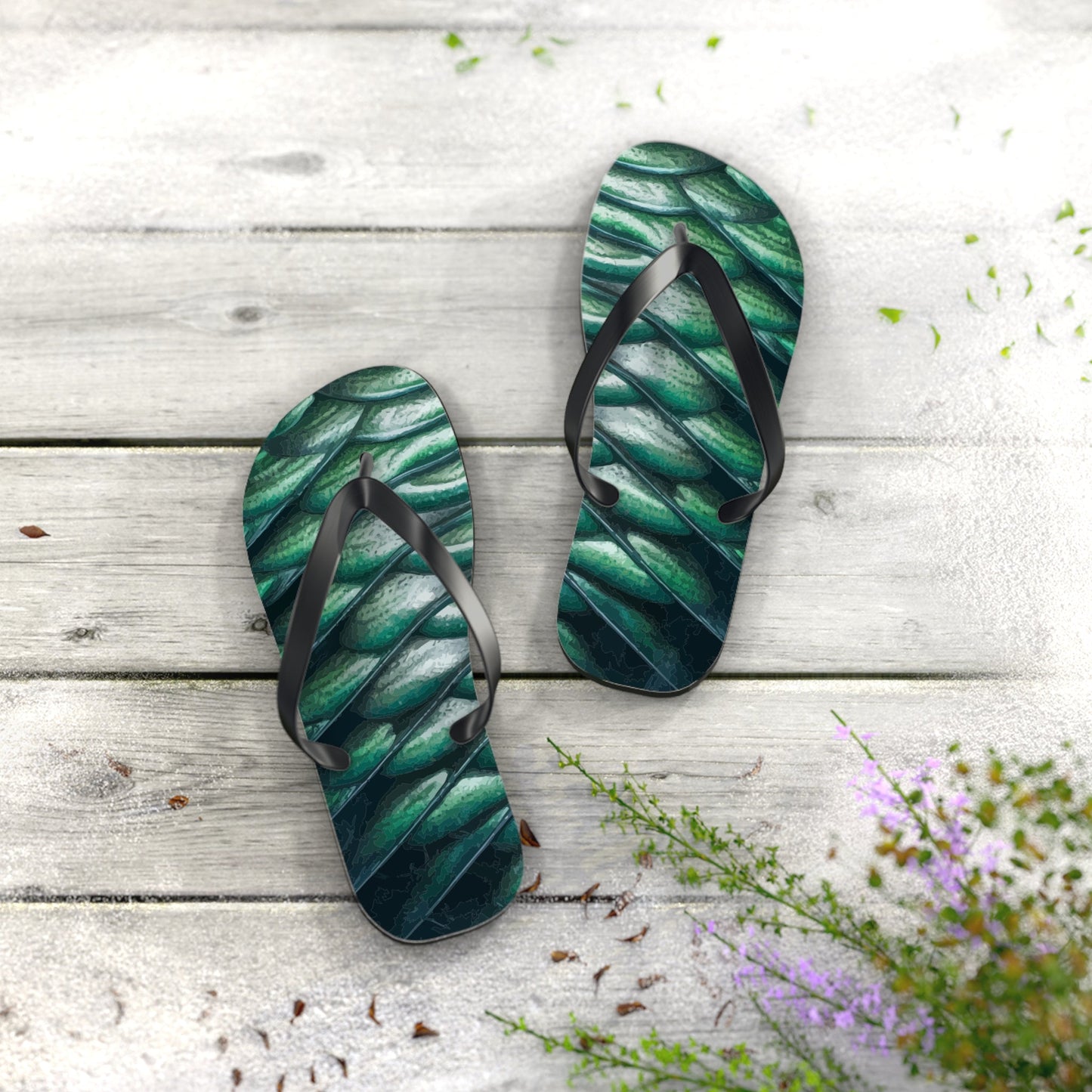 Green scale-pattern flip-flop sandals with black V-shaped straps and textured sole