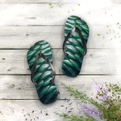 Green scale-pattern flip-flop sandals with black V-shaped straps and textured sole