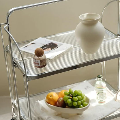 Cream ceramic milk can vase with matte speckled finish displayed on a metal tray.