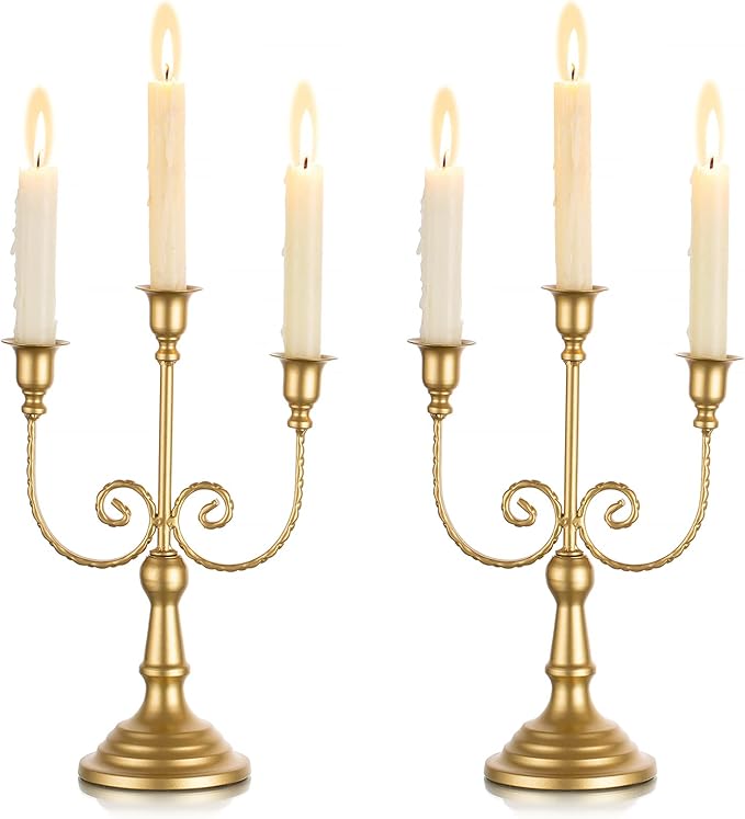 Gold three-stem metal taper candle holder set with ornate scroll arms and pedestal base