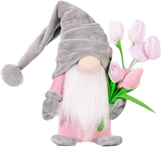 Grey plush gnome with long hat, white beard, pink skirt, and tulip bouquet