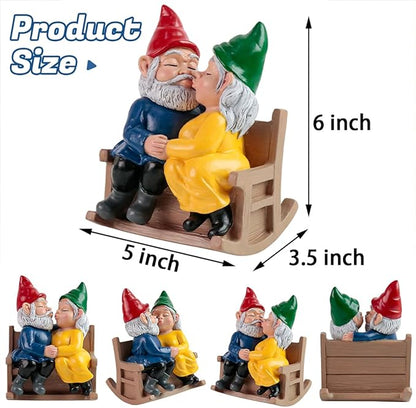Garden gnome couple rocking chair statue, gnomes kissing, red and green hats, blue and yellow