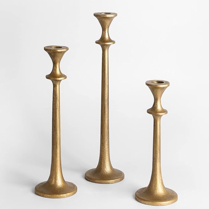 Brass iron taper candle holder set of three, staggered heights, upright.