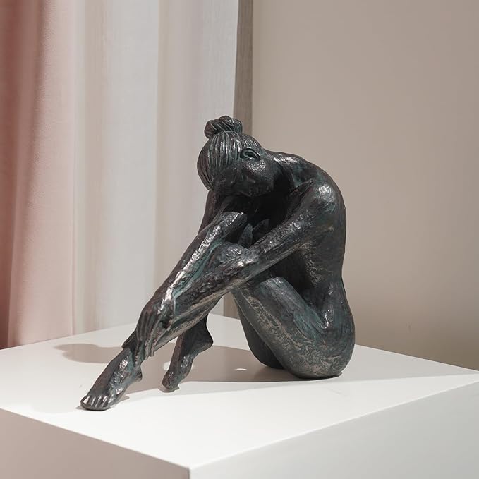 Guichifun dark bronze-finish sculpture of a seated woman reaching toward her foot
