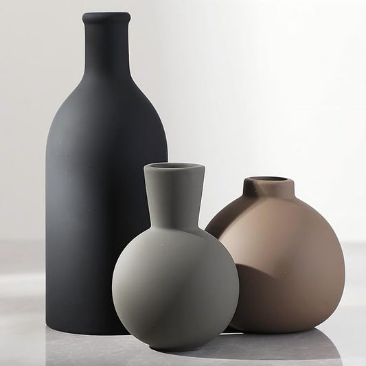 Set of 3 ceramic vases: tall matte black, round gray, and tan rounded vase