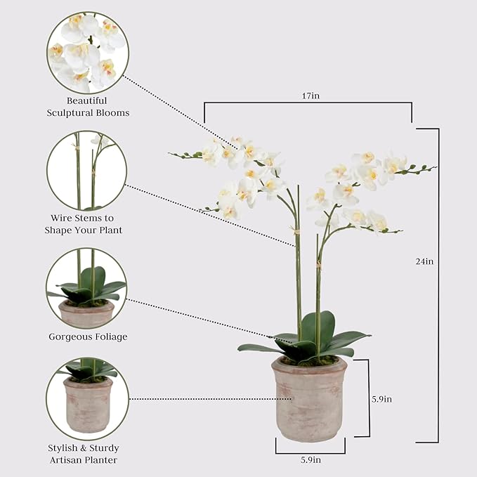 Faux white orchid stems and blooms in gray planter pot with green leaves