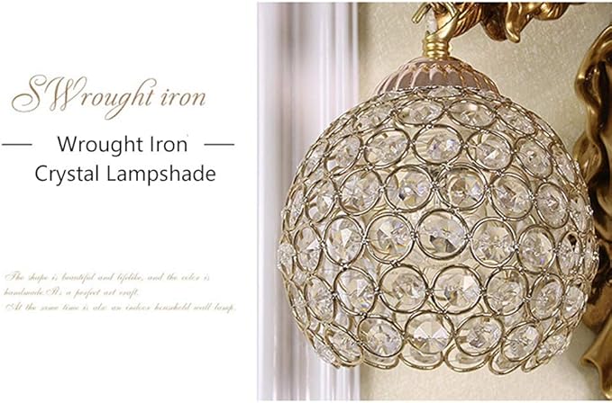 Clear crystal globe lamp shade on gold angel wall sconce