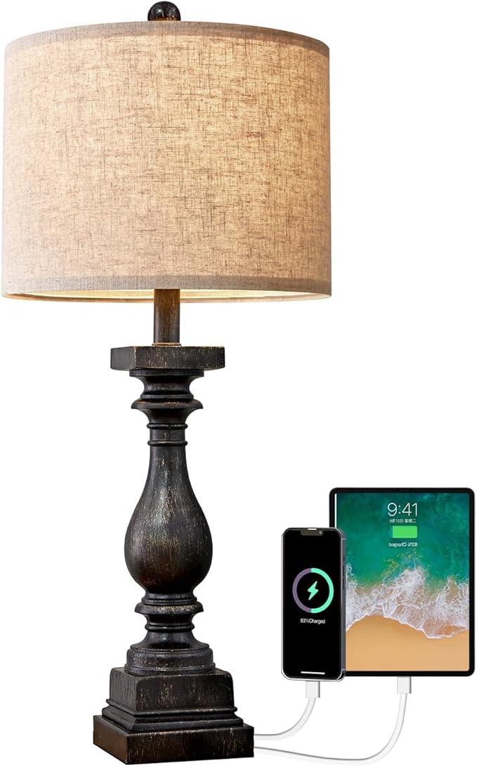 Table lamp close-up with fabric shade, dark resin base, and USB charging ports