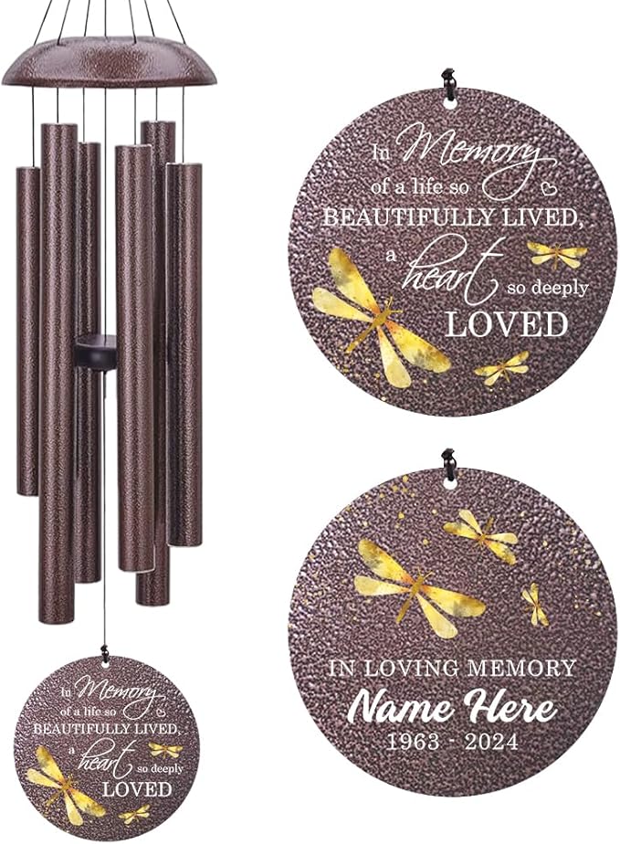 Bronze-tone dragonfly wind chime with speckled tubes and round "In Loving Memory" medallion.