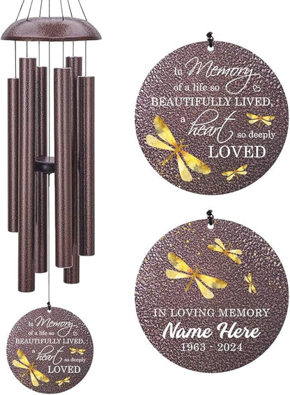 Bronze-tone dragonfly wind chime with speckled tubes and round "In Loving Memory" medallion.