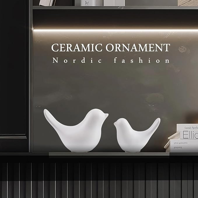 Ceramic white bird figurine set of 2 on shelf, smooth sculpted bodies