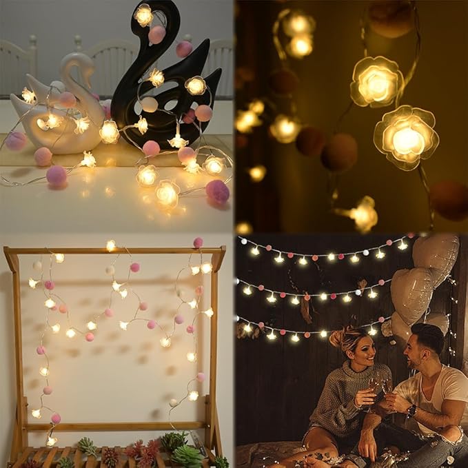 Warm rose LED string lights with pink and peach pom-pom balls for indoor decor