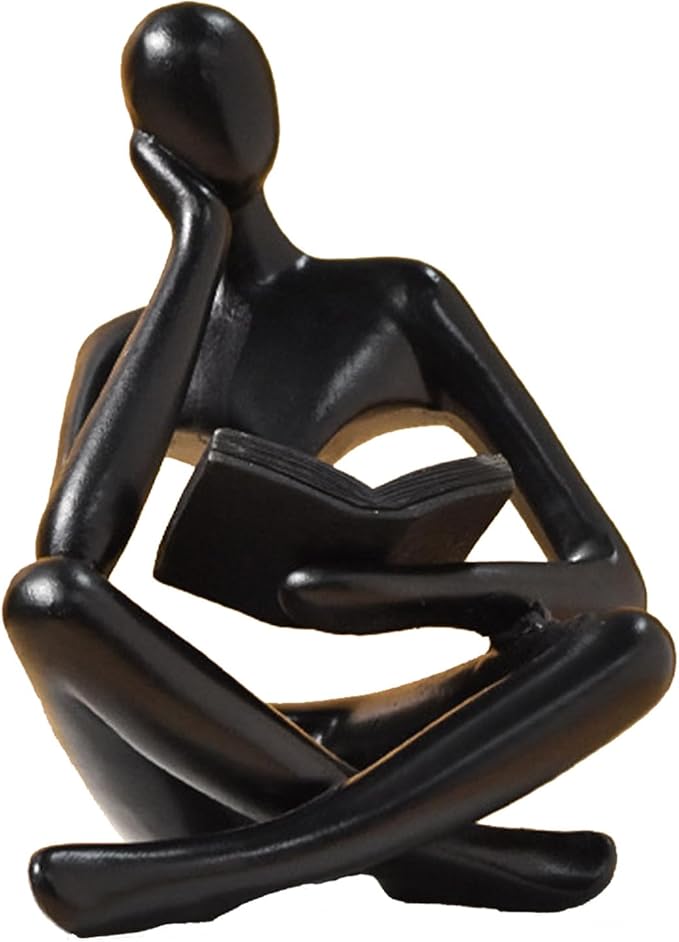 Zuo Si black resin reading thinker figurine, seated with crossed legs and book