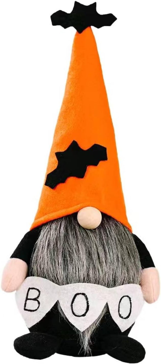 Orange plush witch gnome with black hat trim, gray beard, and white “BOO” heart sign.