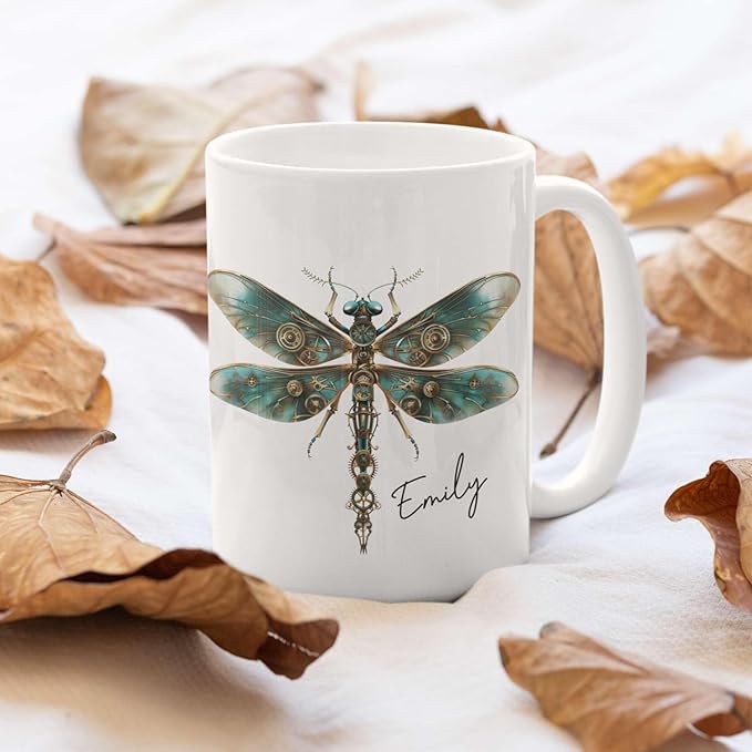 White ceramic mug with teal steampunk dragonfly centerpiece and name Emily
