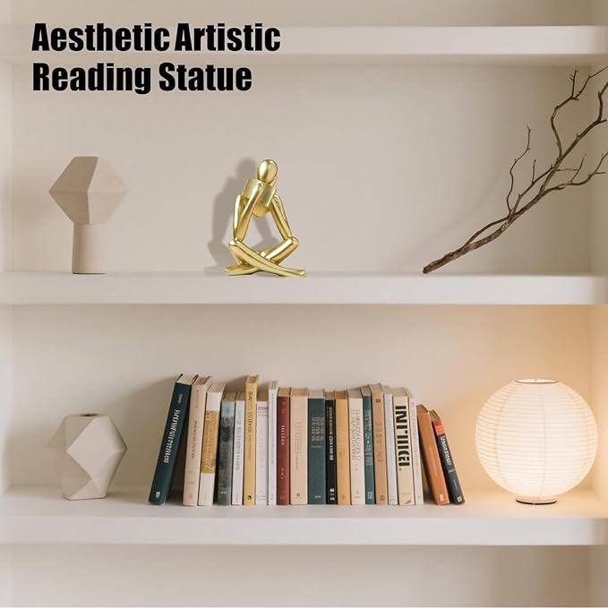 Gold seated reading thinker statue, bent arms and crossed legs bookend decor.