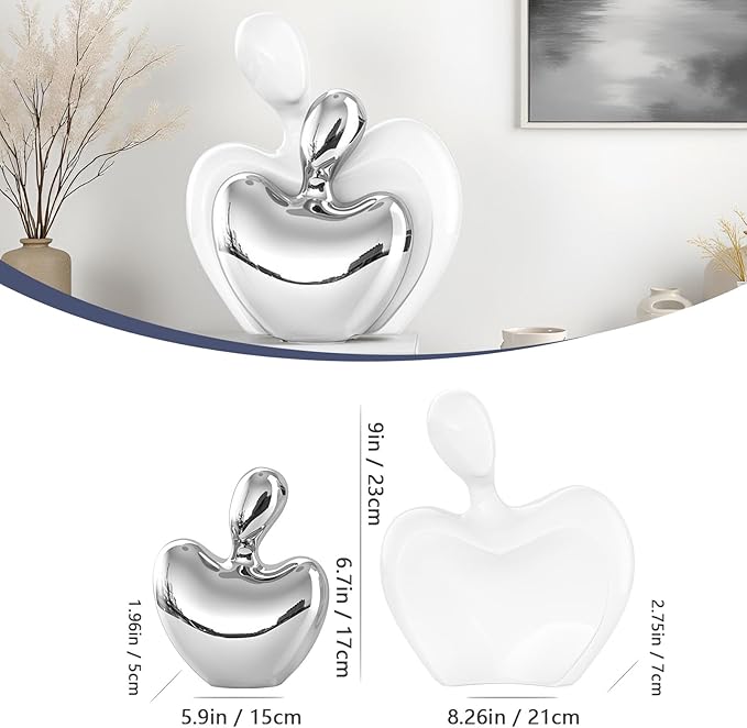 Abstract white and silver ceramic couple figurines forming a heart, hugging pose.