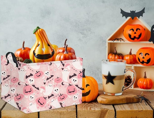 Pink rectangular Halloween treat basket with ghost, pumpkin and bat print, handles on top