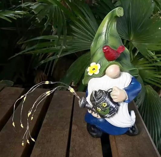 Garden gnome solar lantern statue in green hat holding a lantern, red bird detail