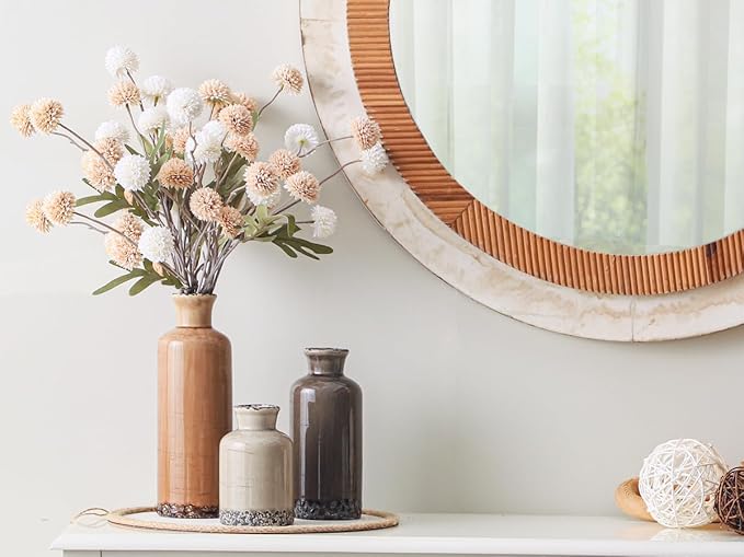 Set of three rustic ceramic vases: tall terracotta, cream, and dark gray on a tray