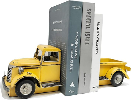 Yellow vintage metal truck book stopper holding upright books, rustic farmhouse style