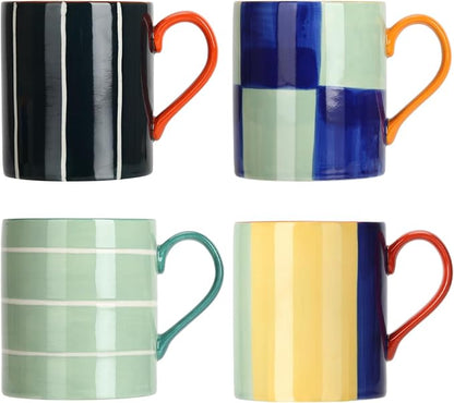 Set of four hand-painted ceramic mugs with striped and checkered colorful glazes, orange handles