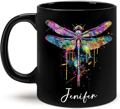Black ceramic coffee mug with colorful dragonfly graphic and custom name