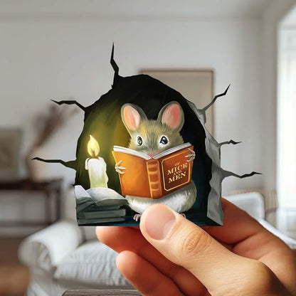 Mouse hole wall decal sticker being held by a hand, featuring a reading mouse