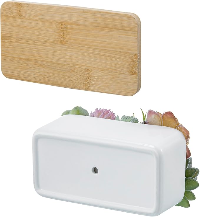 Bamboo tray and white ceramic faux succulent planter base with assorted greenery