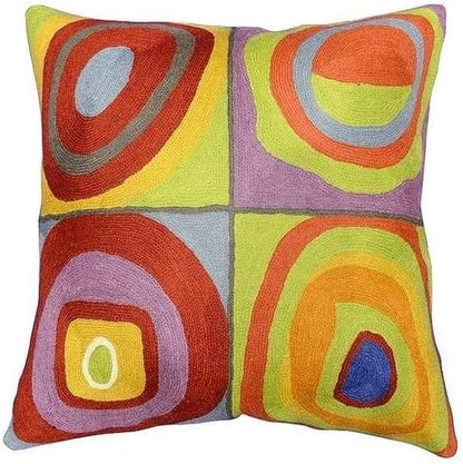 Square pillow cover with four-panel abstract circles in red, blue, purple, and green