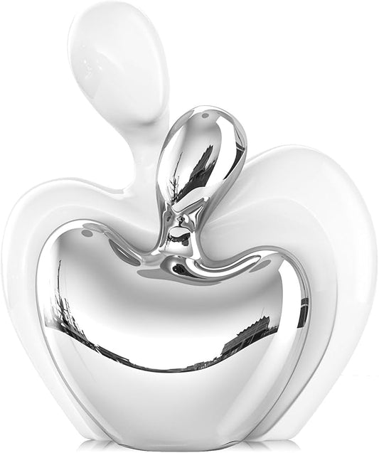 White ceramic couple figurine with silver hugging heart design, glossy finish.