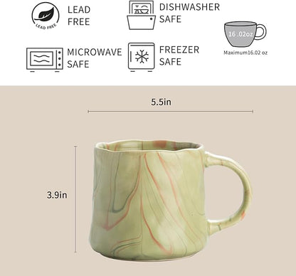 Mint green ceramic mug with abstract red and white line artwork and loop handle