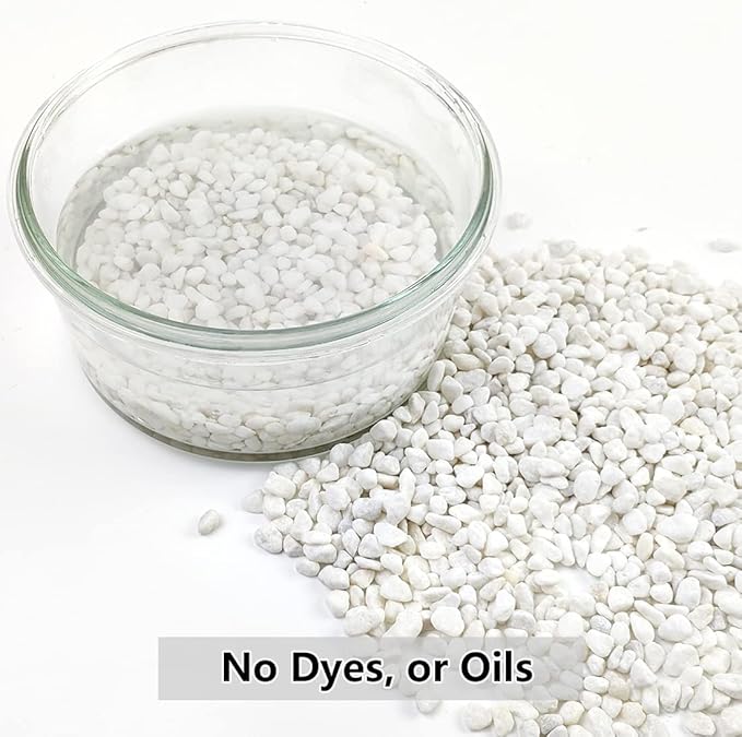 White natural gravel pebbles in a clear glass bowl, small decorative stones