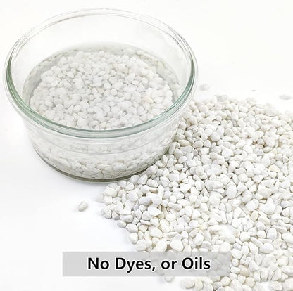 White natural gravel pebbles in a clear glass bowl, small decorative stones