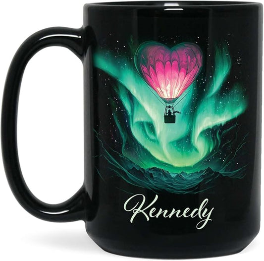 Black ceramic coffee mug with green aurora hot air balloon heart design and name Kennedy