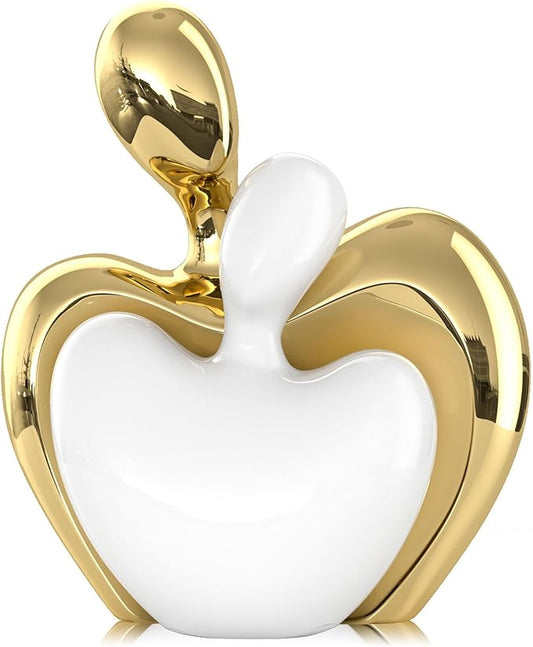 White and gold ceramic hugging couple figurine with raised arms and heart shape