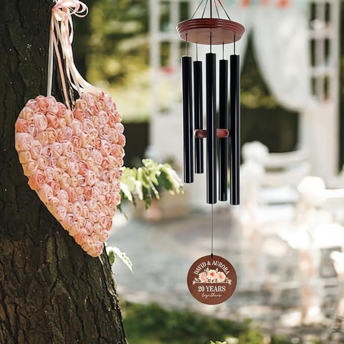 Anniversary wind chime with brown disc reading 20 years together and 5 black tubes