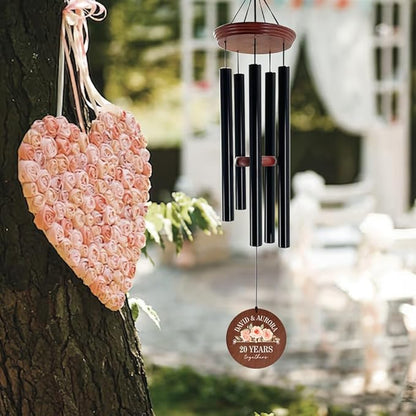 Anniversary wind chime with brown disc reading 20 years together and 5 black tubes