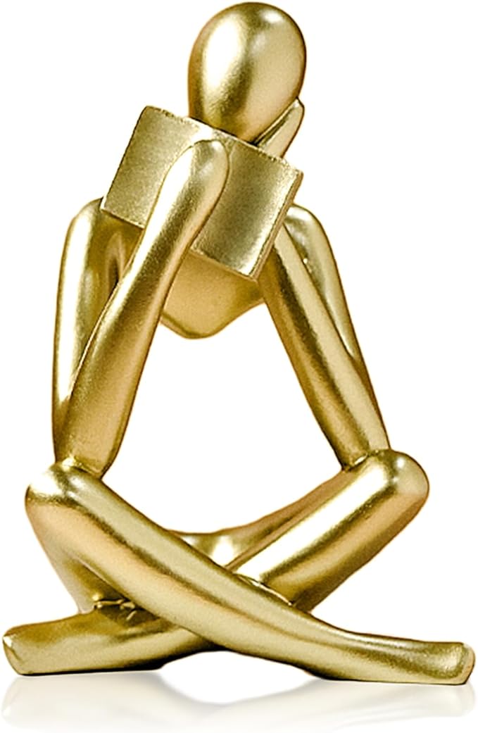 Gold resin reading thinker bookend statue with folded legs, abstract seated pose.