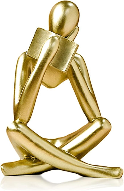 Gold resin reading thinker bookend statue with folded legs, abstract seated pose.