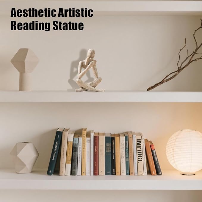 Beige resin reading thinker statue bookend, seated figure holding a small book-like object