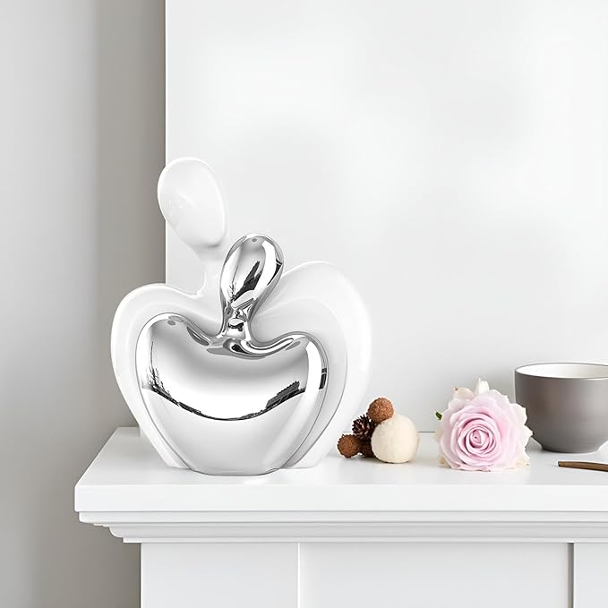 White and silver ceramic embracing couple heart figurine, decorative home decor.