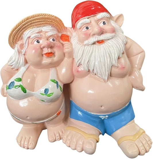 Resin double gnome statue of woman and man, red hats, blue shorts, green accents