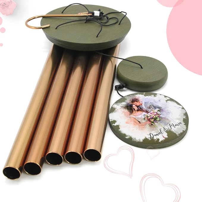 Gold-tone wind chime with dark top base, hanging tubes, and round couple-photo ornament