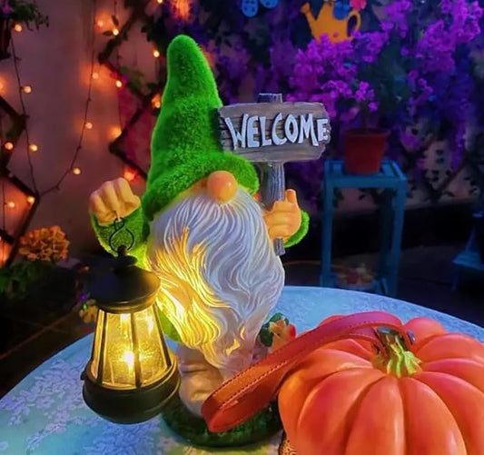 Solar outdoor gnome with lantern and 'WELCOME' sign, green hat, white beard