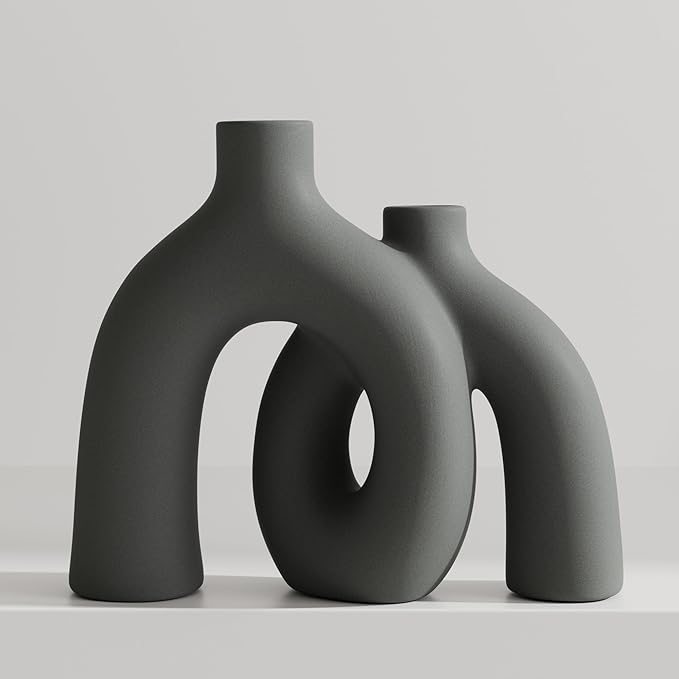 Dark gray matte ceramic vase sculpture with oval donut cutout